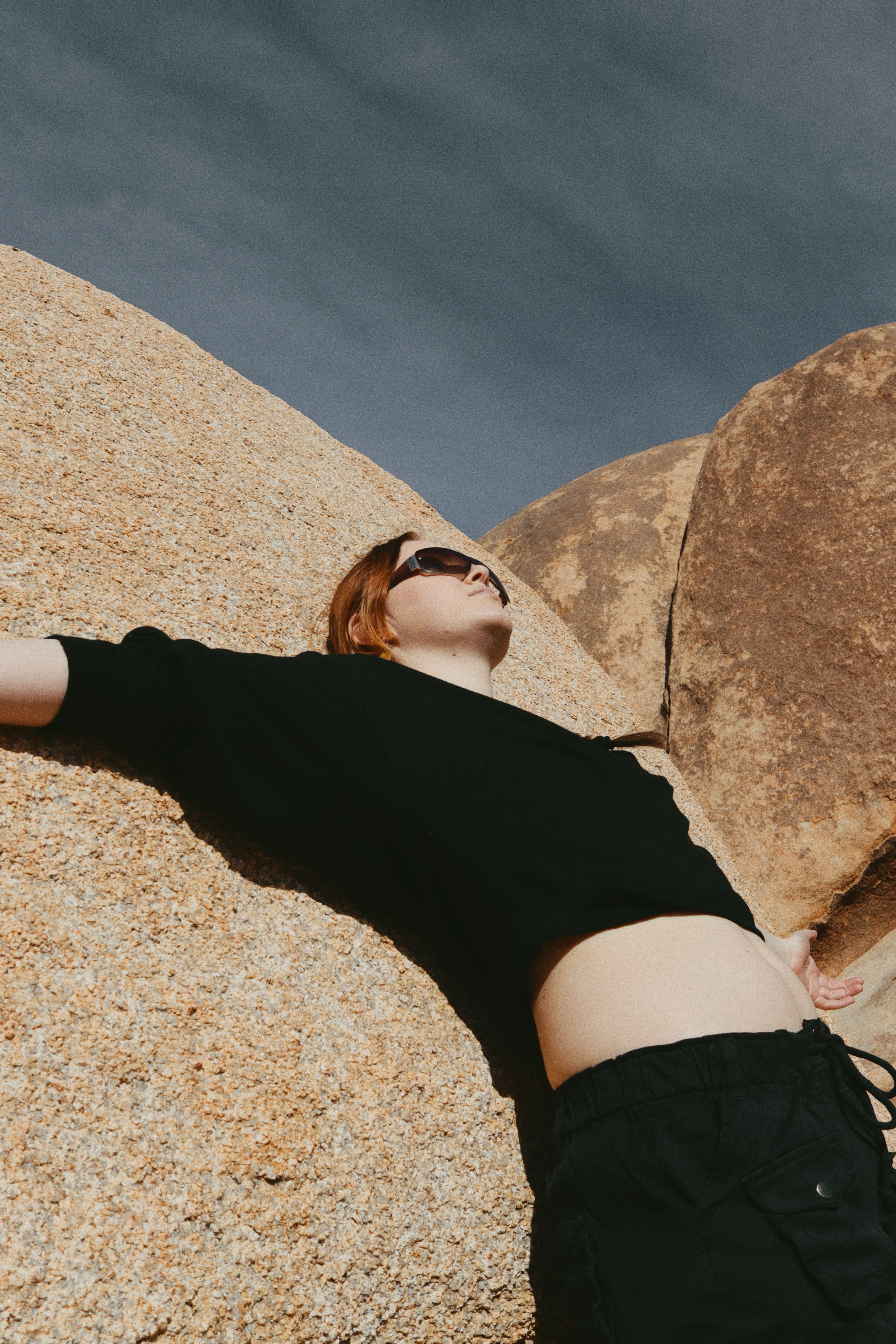 Girl Laying on Rock